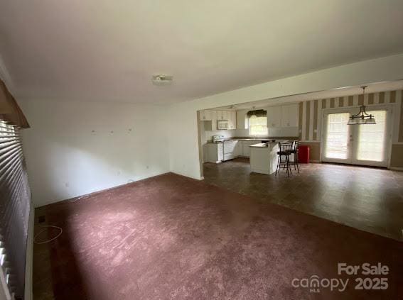 104 Edison St, Kings Mountain, NC 28086 - unfurnished living room with dark carpet