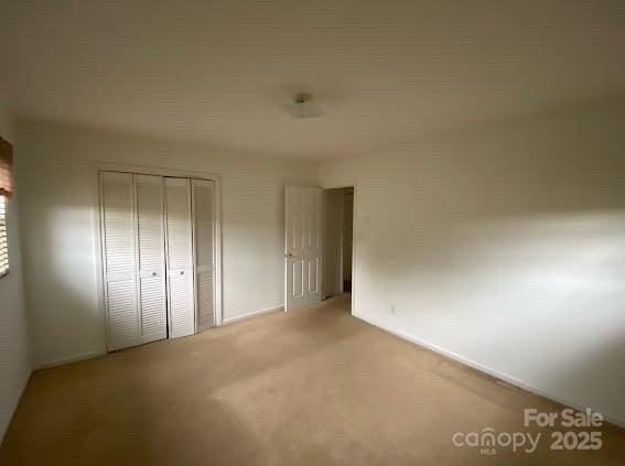 104 Edison St, Kings Mountain, NC 28086 - unfurnished bedroom featuring light carpet and a closet