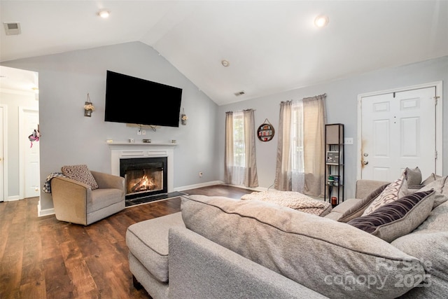 2108 Gambrel Way, Monroe, NC 28112 - living area featuring a fireplace with flush hearth, lofted ceiling, and dark wood-style flooring