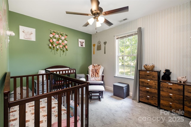 2108 Gambrel Way, Monroe, NC 28112 - carpeted bedroom with wallpapered walls, a nursery area, and ceiling fan