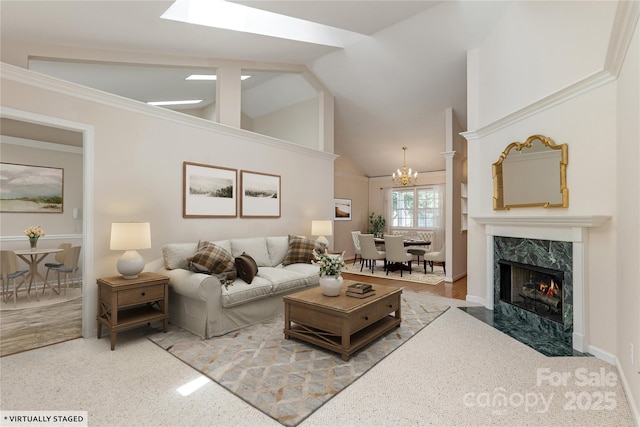 1105 Citation Cir, Hendersonville, NC 28739 - living room with a chandelier, a premium fireplace, high vaulted ceiling, and carpet flooring