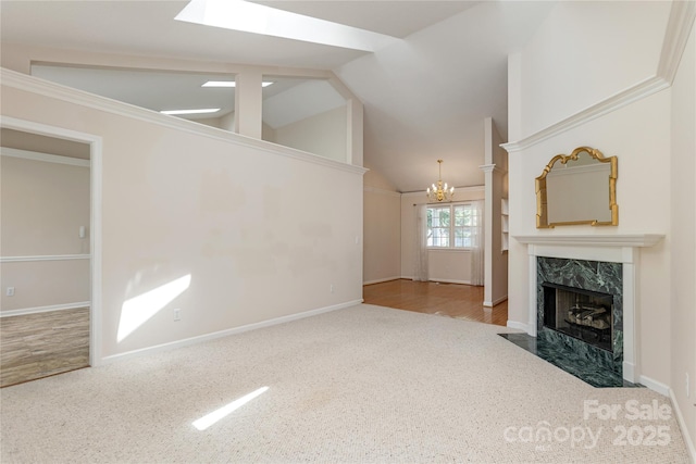 1105 Citation Cir, Hendersonville, NC 28739 - unfurnished living room featuring carpet floors, a chandelier, a fireplace, and vaulted ceiling