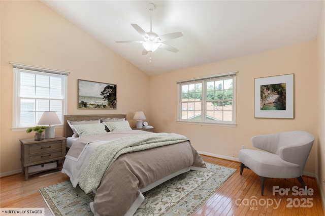 1105 Citation Cir, Hendersonville, NC 28739 - bedroom featuring light wood finished floors, vaulted ceiling, and ceiling fan