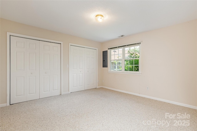 1105 Citation Cir, Hendersonville, NC 28739 - unfurnished bedroom with two closets, carpet flooring, and electric panel