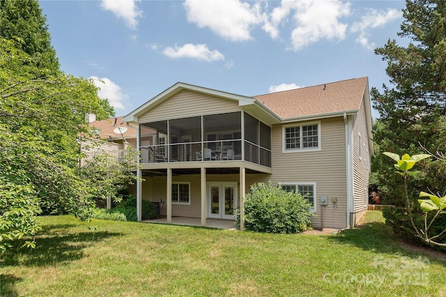 1105 Citation Cir, Hendersonville, NC 28739 - back of house featuring a patio, a lawn, a sunroom, and french doors