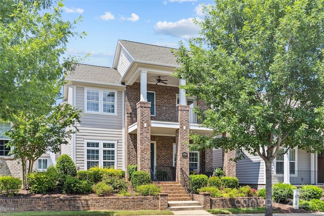 4928 Providence Country Club Dr, Charlotte, NC 28277 - view of front of property with ceiling fan, a balcony, brick siding, and a shingled roof