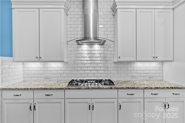 4928 Providence Country Club Dr, Charlotte, NC 28277 - kitchen featuring wall chimney range hood, stainless steel gas stovetop, white cabinetry, and decorative backsplash