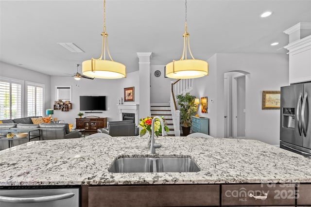 4928 Providence Country Club Dr, Charlotte, NC 28277 - kitchen with a ceiling fan, recessed lighting, hanging light fixtures, open floor plan, and stainless steel appliances