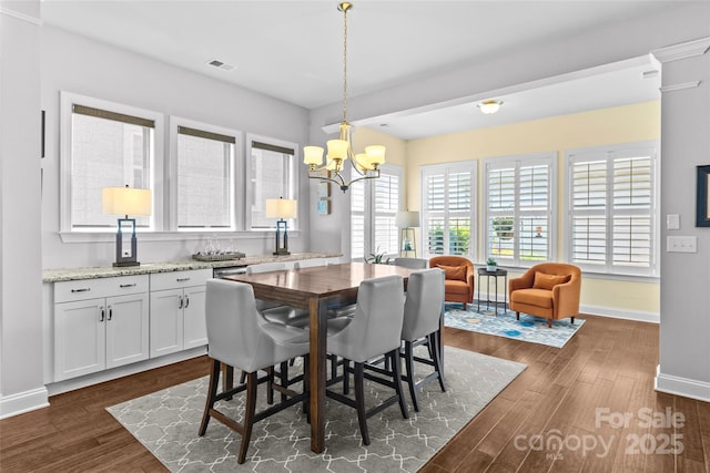 4928 Providence Country Club Dr, Charlotte, NC 28277 - dining room featuring a chandelier and dark wood-style floors