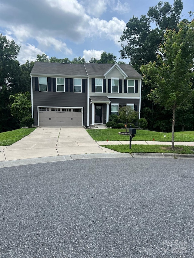 1076 Tangle Ridge Dr SE, Concord, NC 28025 - view of front of home featuring driveway, an attached garage, and a front yard