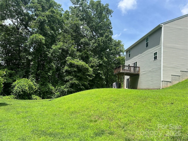1076 Tangle Ridge Dr SE, Concord, NC 28025 - view of grassy yard featuring a deck