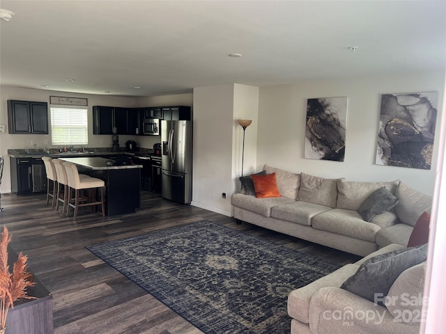 1076 Tangle Ridge Dr SE, Concord, NC 28025 - living area with dark wood finished floors and recessed lighting