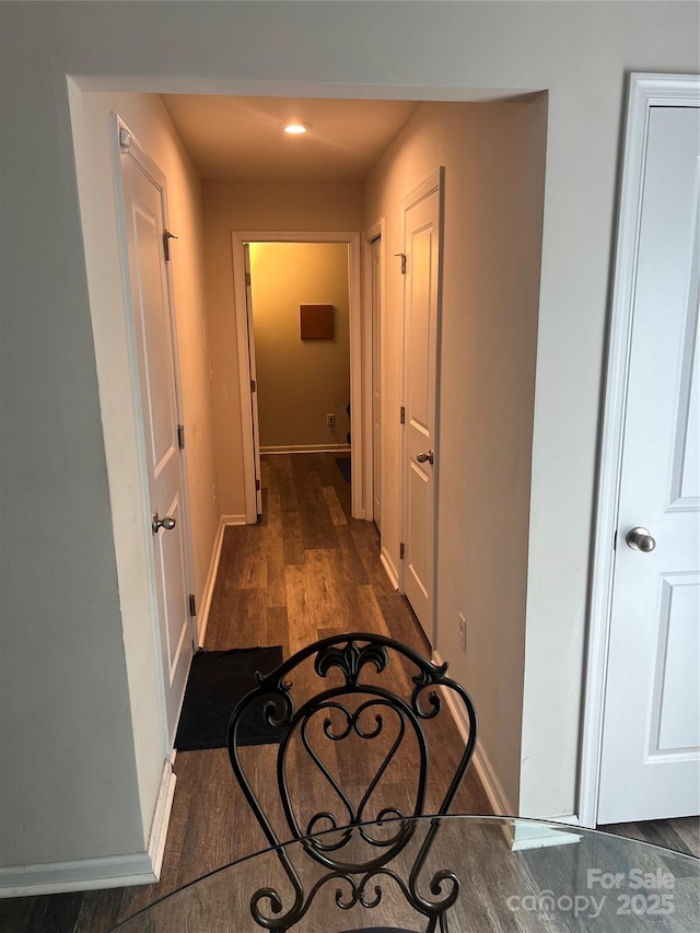 1076 Tangle Ridge Dr SE, Concord, NC 28025 - corridor with dark wood-style flooring and baseboards