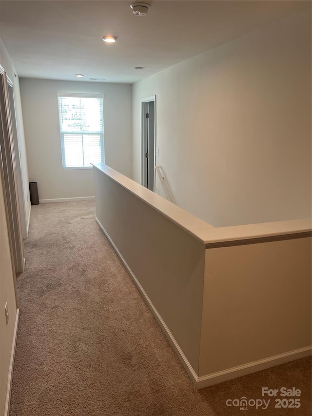 1076 Tangle Ridge Dr SE, Concord, NC 28025 - corridor featuring carpet floors, an upstairs landing, and recessed lighting