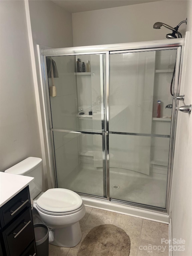 1076 Tangle Ridge Dr SE, Concord, NC 28025 - full bathroom with a shower stall, vanity, and tile patterned flooring