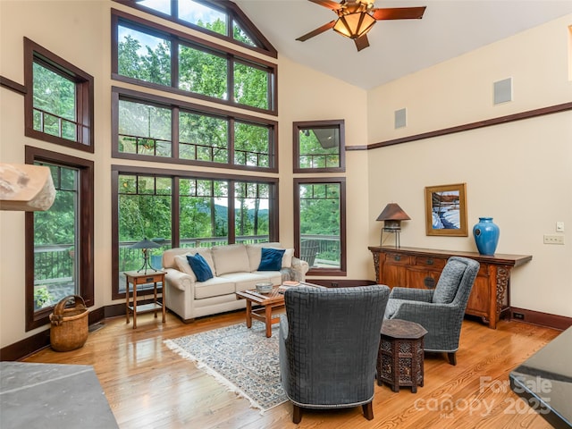 935 Whites Lake Blvd, Saluda, NC 28773 - living area featuring high vaulted ceiling, ceiling fan, and wood finished floors