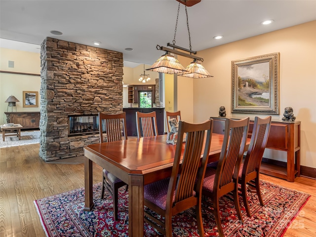 935 Whites Lake Blvd, Saluda, NC 28773 - dining space featuring wood finished floors, a stone fireplace, and recessed lighting