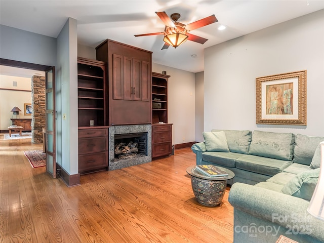 935 Whites Lake Blvd, Saluda, NC 28773 - living area with a fireplace, a ceiling fan, light wood-style floors, and recessed lighting