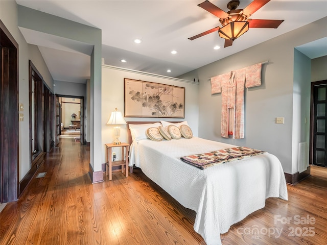 935 Whites Lake Blvd, Saluda, NC 28773 - bedroom with wood finished floors, recessed lighting, and a ceiling fan