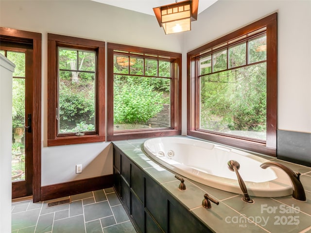 935 Whites Lake Blvd, Saluda, NC 28773 - full bathroom featuring a jetted tub and baseboards