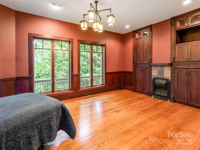 935 Whites Lake Blvd, Saluda, NC 28773 - bedroom with light wood finished floors, a wainscoted wall, recessed lighting, and heating unit
