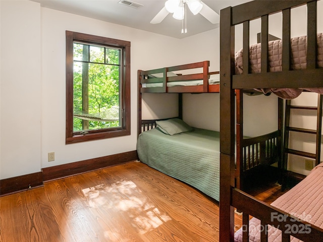 935 Whites Lake Blvd, Saluda, NC 28773 - bedroom with wood finished floors and a ceiling fan