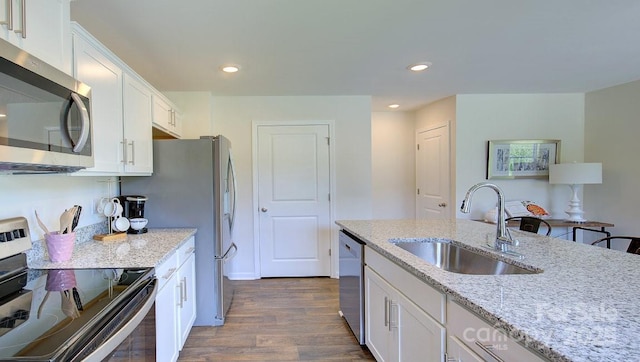 12 Wildbrook Dr, Waynesville, NC 28785 - kitchen with appliances with stainless steel finishes, dark wood-style floors, white cabinetry, light stone countertops, and recessed lighting