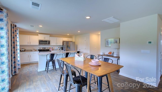 12 Wildbrook Dr, Waynesville, NC 28785 - dining room featuring wood finished floors and recessed lighting