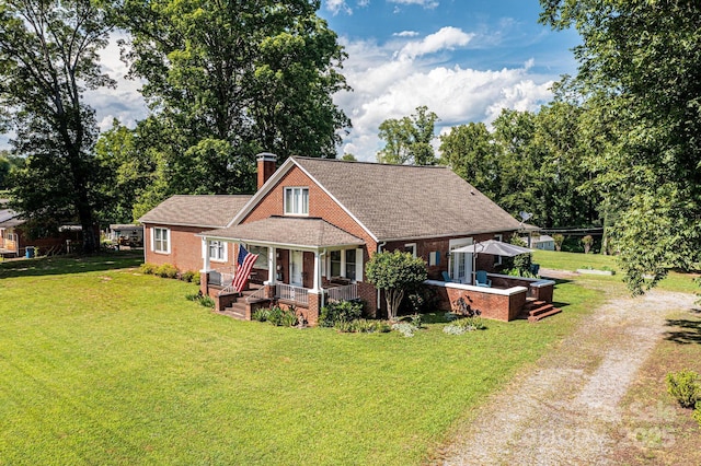 2035 Kool Park Rd NE, Hickory, NC 28601 - bungalow-style house featuring dirt driveway, a porch, brick siding, and a front yard