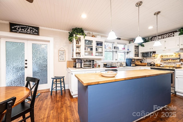 2035 Kool Park Rd NE, Hickory, NC 28601 - kitchen featuring butcher block counters, stainless steel appliances, crown molding, dark wood-style flooring, and white cabinetry