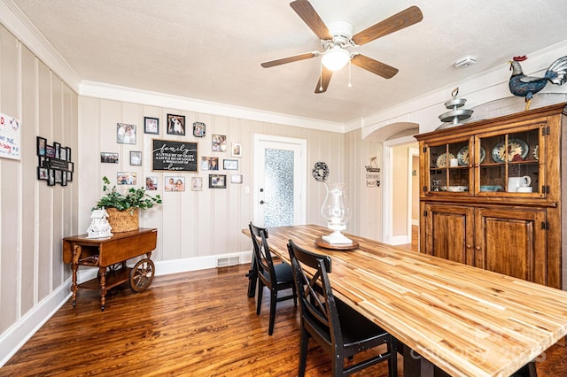 2035 Kool Park Rd NE, Hickory, NC 28601 - dining room with crown molding, dark wood-style floors, a ceiling fan, and arched walkways