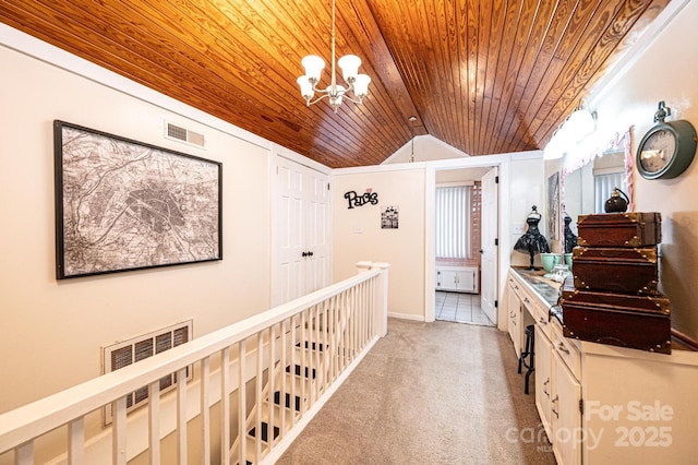 2035 Kool Park Rd NE, Hickory, NC 28601 - hall featuring wood ceiling, vaulted ceiling, a chandelier, and light carpet