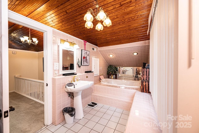 2035 Kool Park Rd NE, Hickory, NC 28601 - full bath featuring a chandelier, a bath, wood ceiling, tile patterned floors, and tile walls