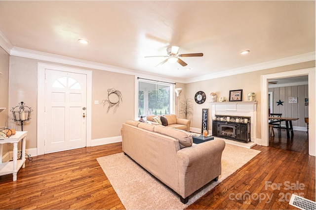 2035 Kool Park Rd NE, Hickory, NC 28601 - living room with a ceiling fan, wood finished floors, crown molding, a fireplace with raised hearth, and recessed lighting