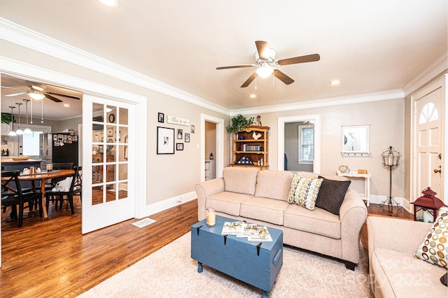 2035 Kool Park Rd NE, Hickory, NC 28601 - living area featuring a ceiling fan, wood finished floors, ornamental molding, healthy amount of natural light, and recessed lighting