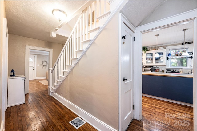 2035 Kool Park Rd NE, Hickory, NC 28601 - stairway with hardwood / wood-style floors and a textured ceiling