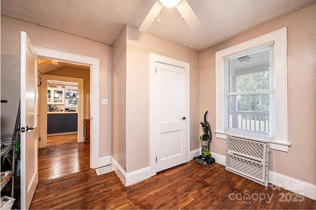 2035 Kool Park Rd NE, Hickory, NC 28601 - foyer entrance featuring dark wood finished floors, a ceiling fan, and a textured ceiling