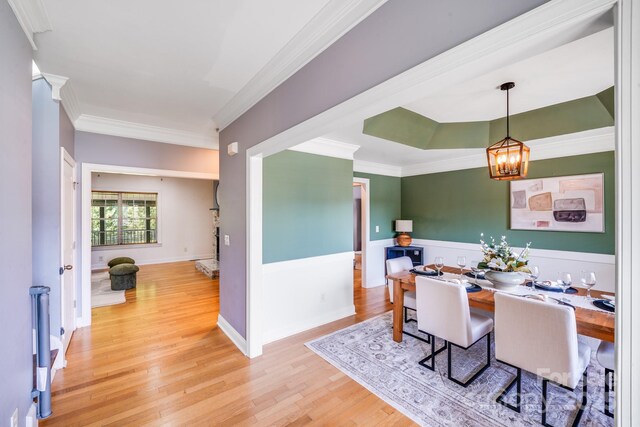 4525 Chestwood Ct, Rock Hill, SC 29732 - dining space featuring wood finished floors, crown molding, and a chandelier