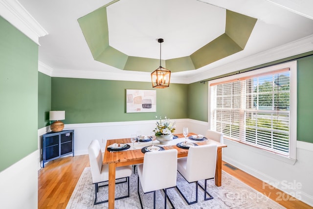 4525 Chestwood Ct, Rock Hill, SC 29732 - dining room featuring a chandelier, ornamental molding, wood finished floors, and a tray ceiling