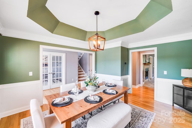 4525 Chestwood Ct, Rock Hill, SC 29732 - dining space featuring french doors, a chandelier, crown molding, stairs, and wood finished floors