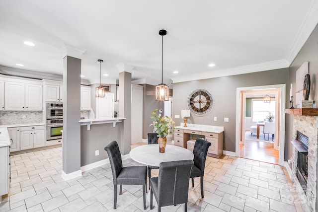 4525 Chestwood Ct, Rock Hill, SC 29732 - dining space featuring a fireplace, crown molding, and recessed lighting