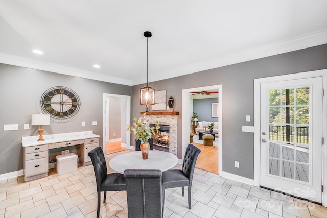 4525 Chestwood Ct, Rock Hill, SC 29732 - dining space with crown molding, a lit fireplace, recessed lighting, and light tile patterned floors
