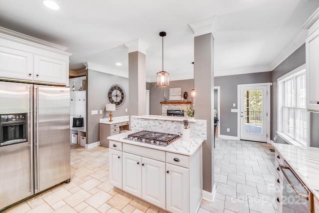4525 Chestwood Ct, Rock Hill, SC 29732 - kitchen featuring appliances with stainless steel finishes, decorative backsplash, white cabinets, light stone counters, and pendant lighting