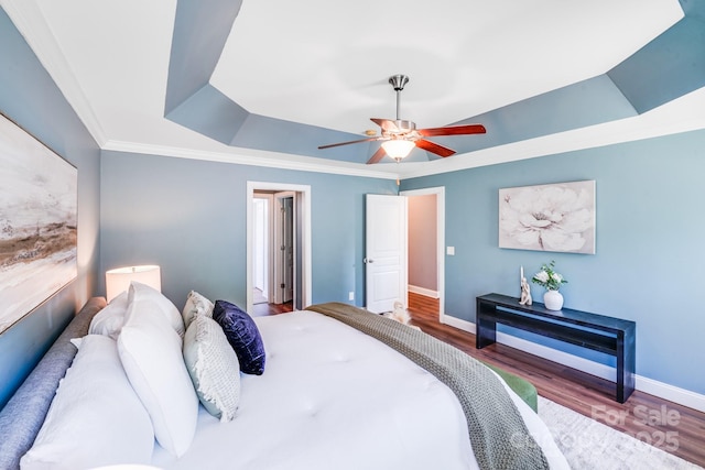 4525 Chestwood Ct, Rock Hill, SC 29732 - bedroom featuring a tray ceiling, wood finished floors, ceiling fan, and ornamental molding