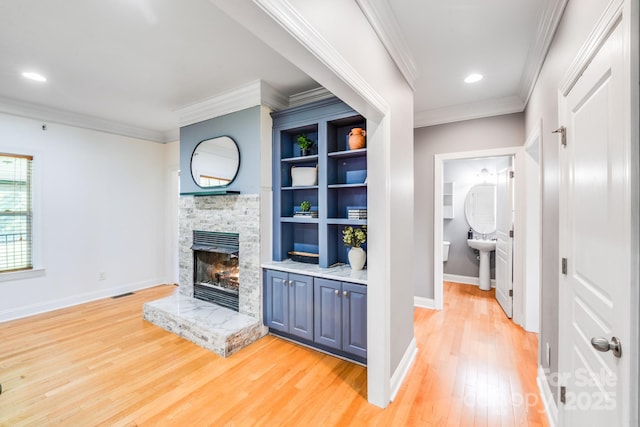 4525 Chestwood Ct, Rock Hill, SC 29732 - unfurnished living room with a fireplace, light wood-style floors, crown molding, and recessed lighting
