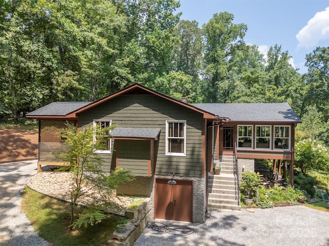 85 Red Bird Rd, Tryon, NC 28782 - view of front facade featuring roof with shingles and asphalt driveway