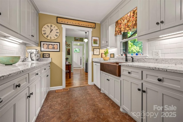 85 Red Bird Rd, Tryon, NC 28782 - kitchen with backsplash, white dishwasher, crown molding, and light stone counters