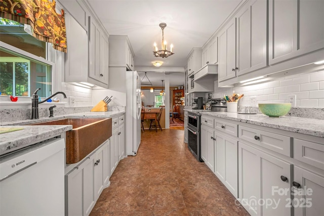 85 Red Bird Rd, Tryon, NC 28782 - kitchen featuring white appliances, a chandelier, tasteful backsplash, and white cabinets