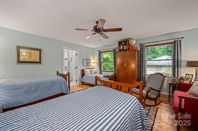 85 Red Bird Rd, Tryon, NC 28782 - bedroom featuring multiple windows, light wood-type flooring, and ceiling fan
