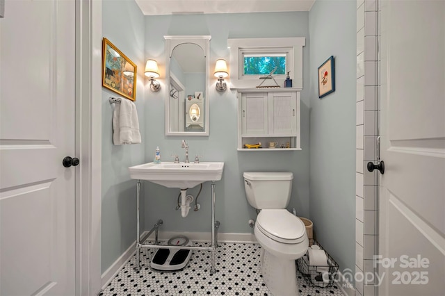 85 Red Bird Rd, Tryon, NC 28782 - bathroom featuring baseboards and toilet